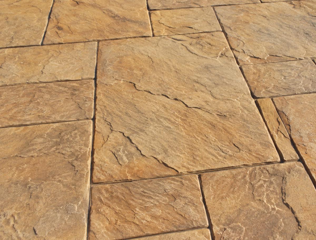 Close-up of stamped concrete with a slate stone pattern